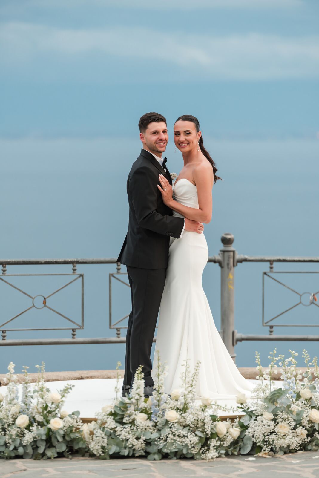 The couple on the terrace above the sea