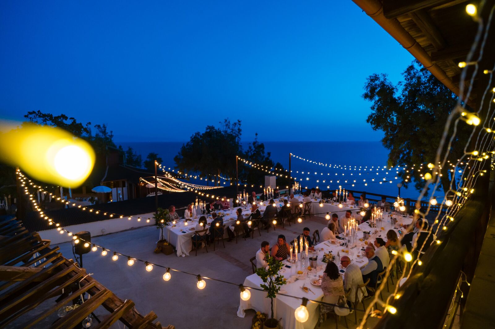 Dinner tables on the terrace at blue hour